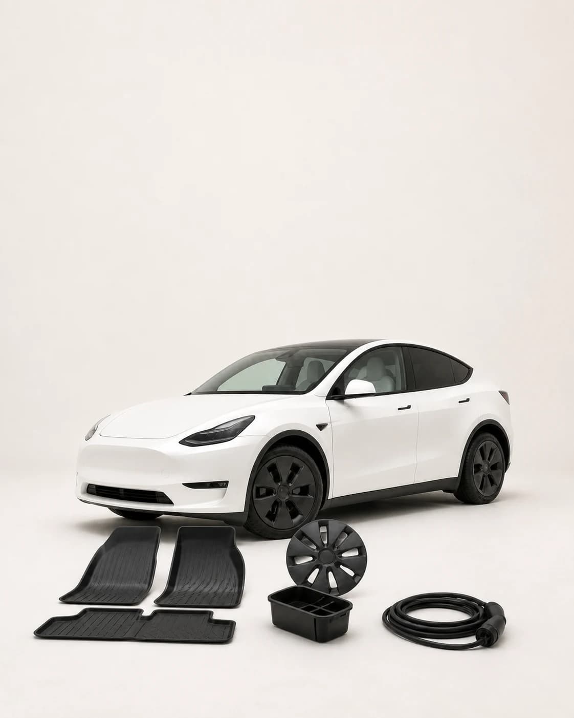 White electric car displayed with floor mats, a console organizer, wheel cover and charging cable